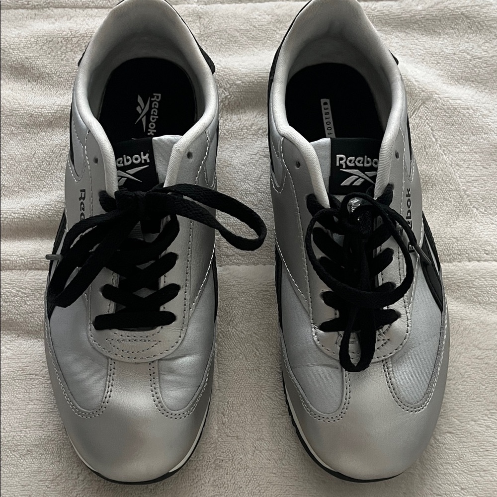 Reebok women’s Metallic Silver and Black Sneakers